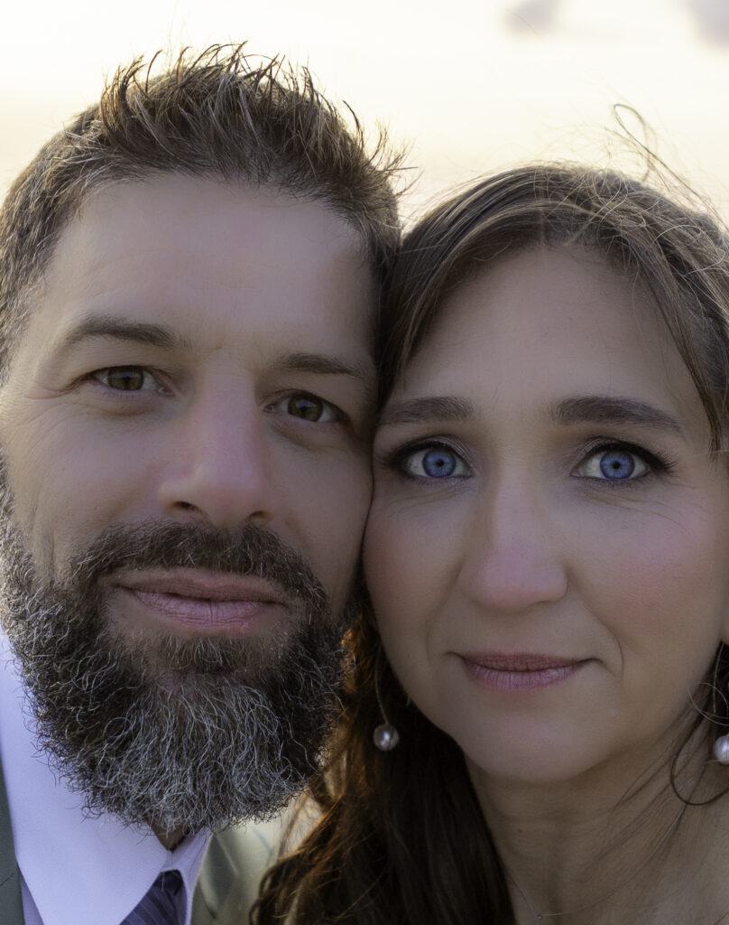 close up image of wedding couple's faces 