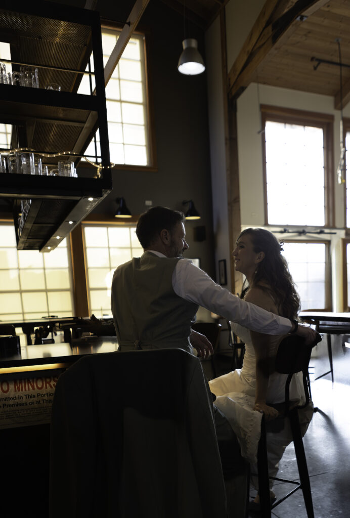 couple sitting at bar enjoying each others company