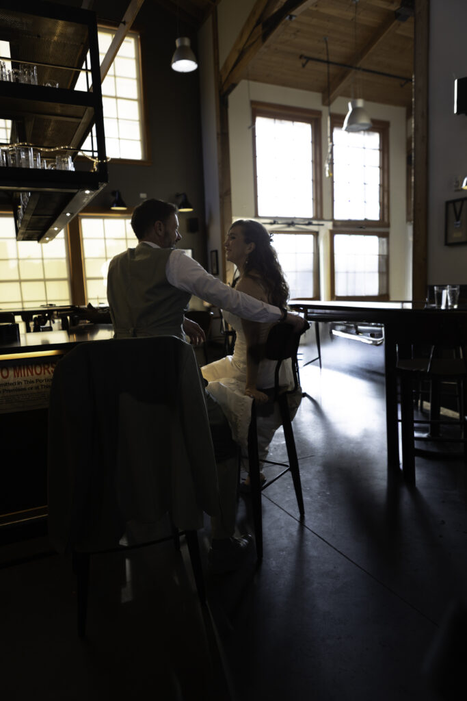 couple sitting at bar enjoying each others company
