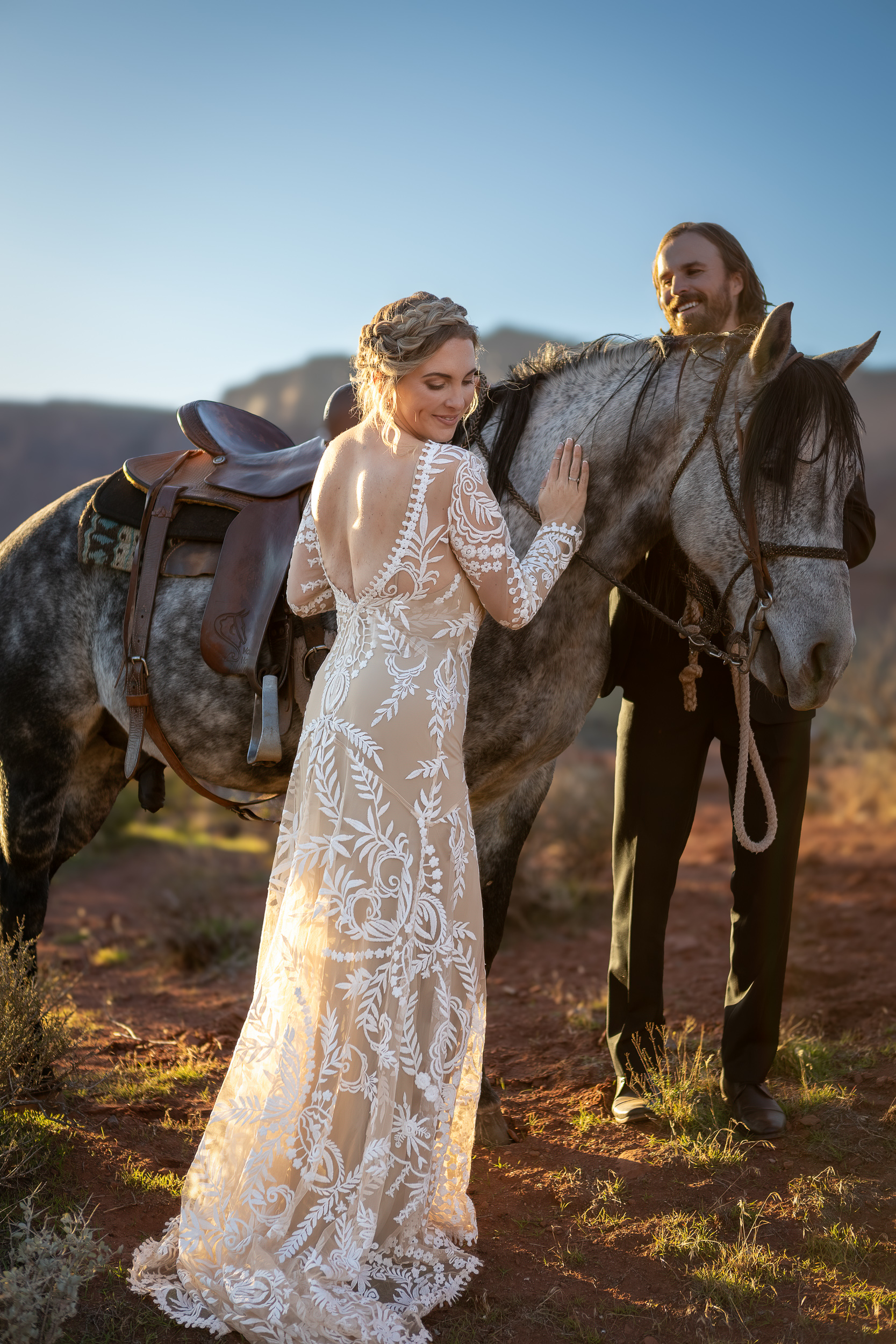 couple standing by horse during activity during elopement day