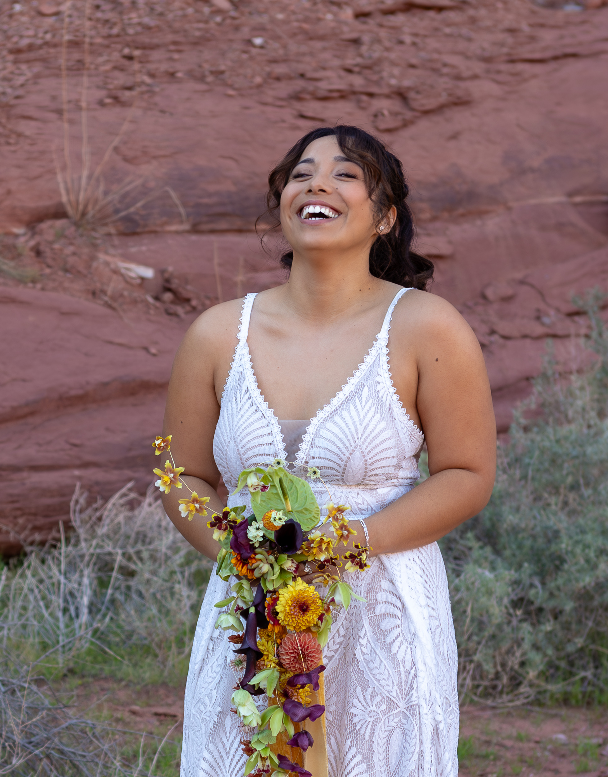 Laura laughing hard at something Hugo said