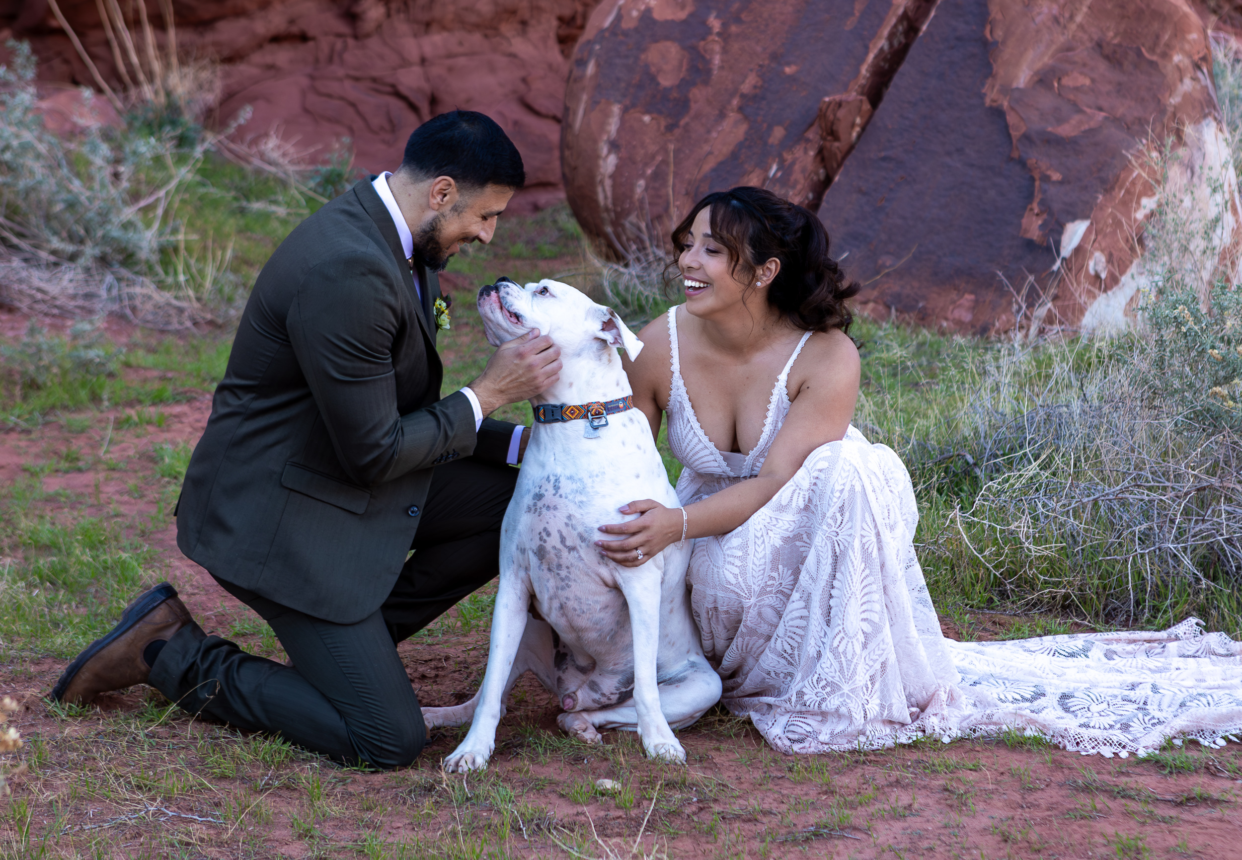 Laura and Hugo play with their dog 
