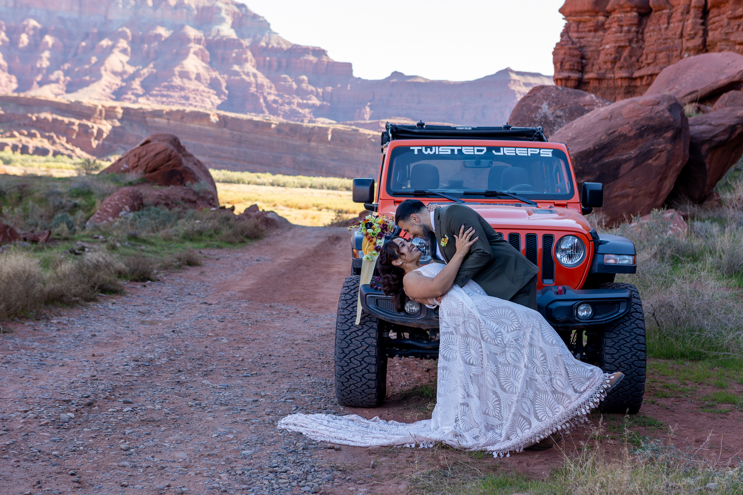 Hugo goes in for a dip and a kiss in front of the jeep