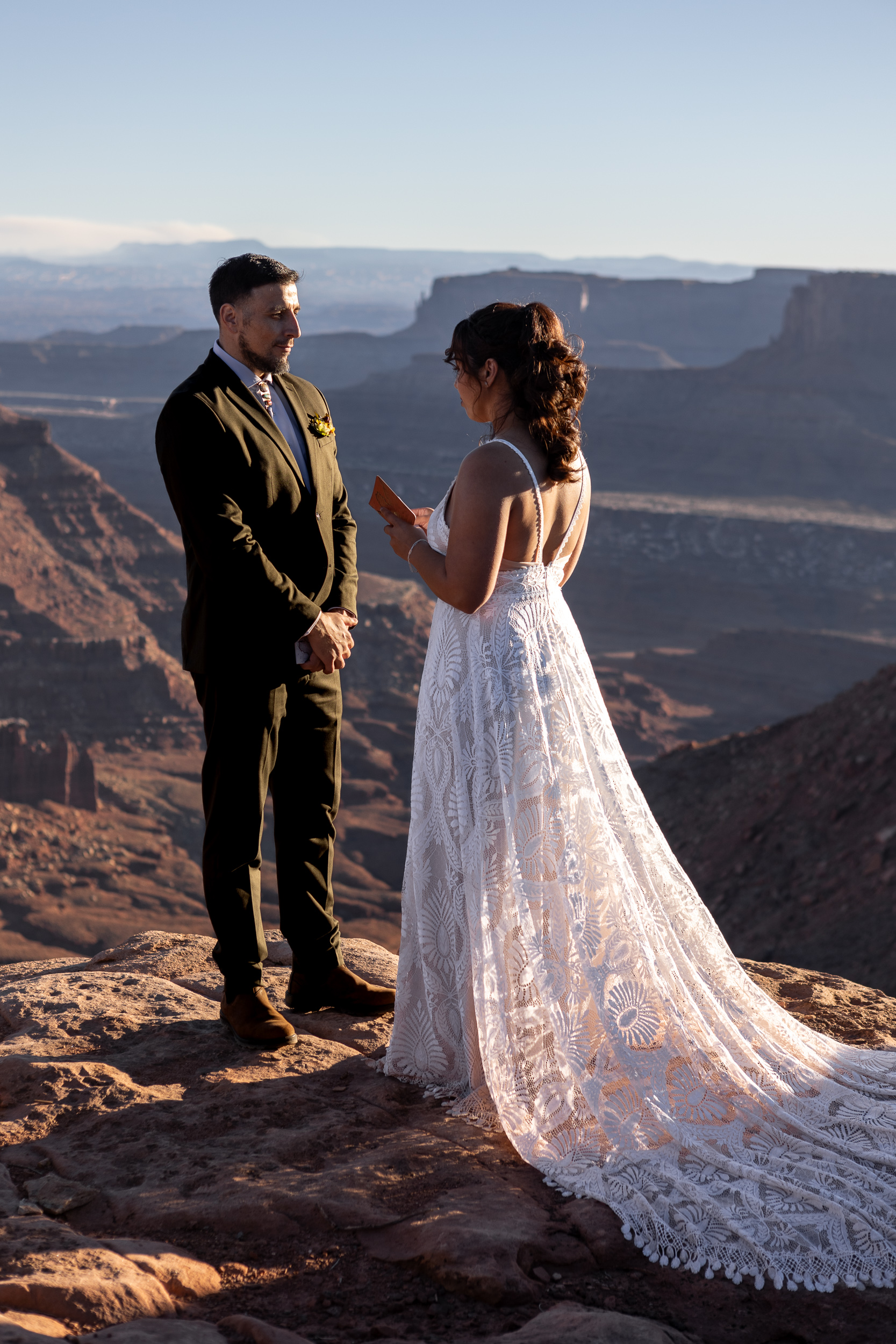 couple saying vows on top of a cliff, no one around