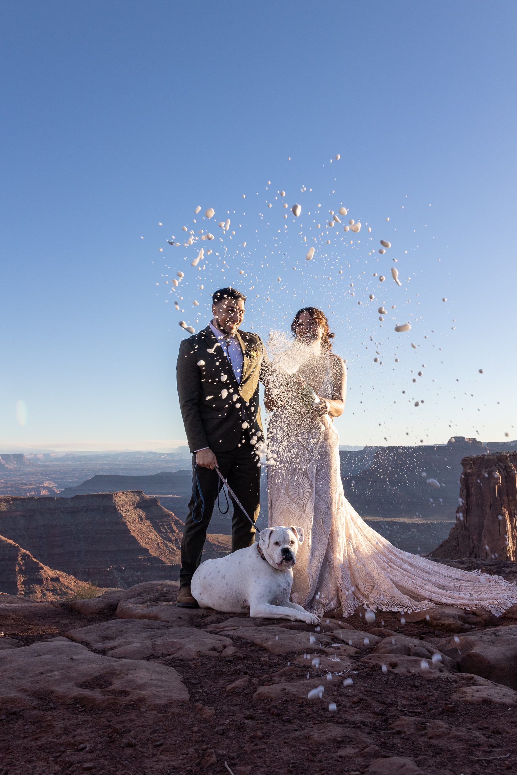 Golden hour champagne toast during a Moab elopement timeline