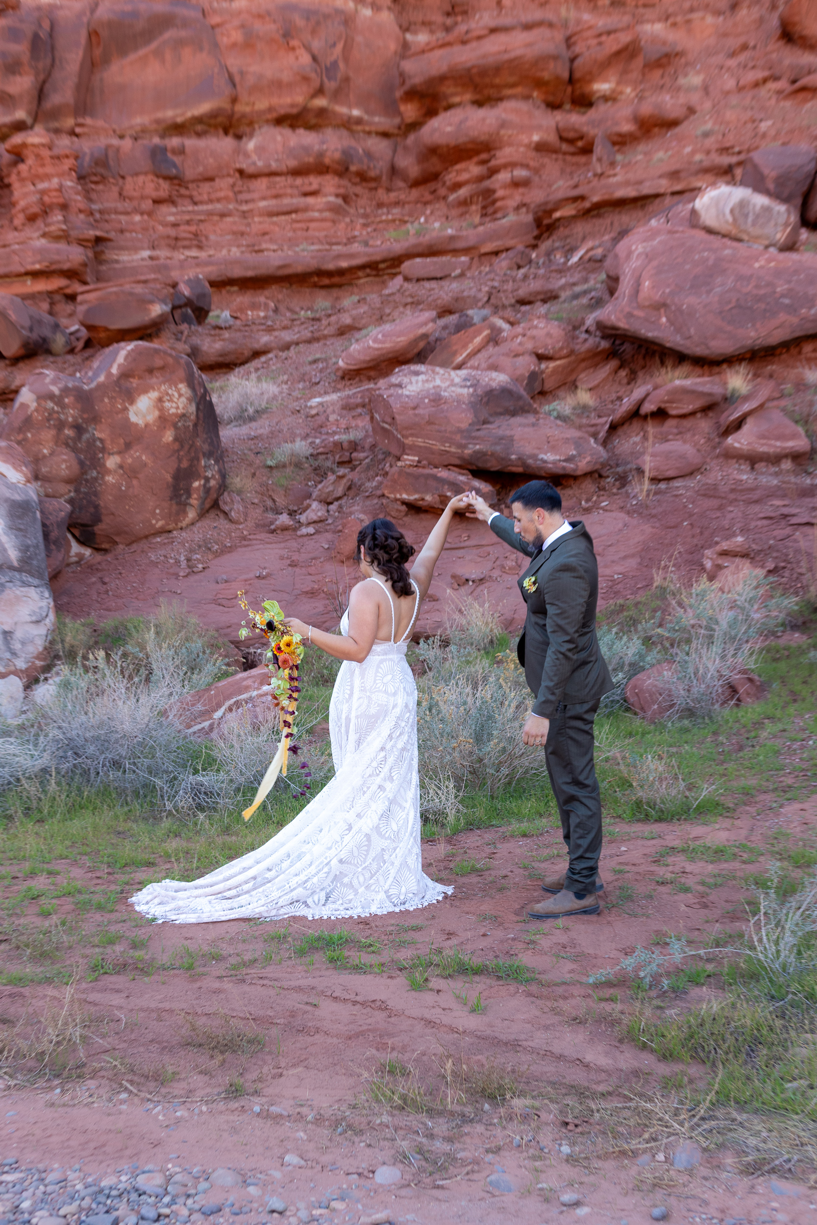 Hugo gives Laura a spin to see her dress fully during first look