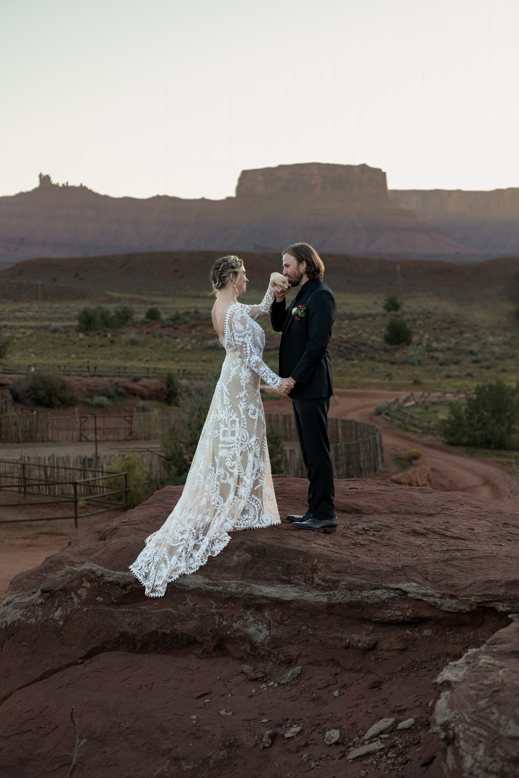 husband kisses wife on hand