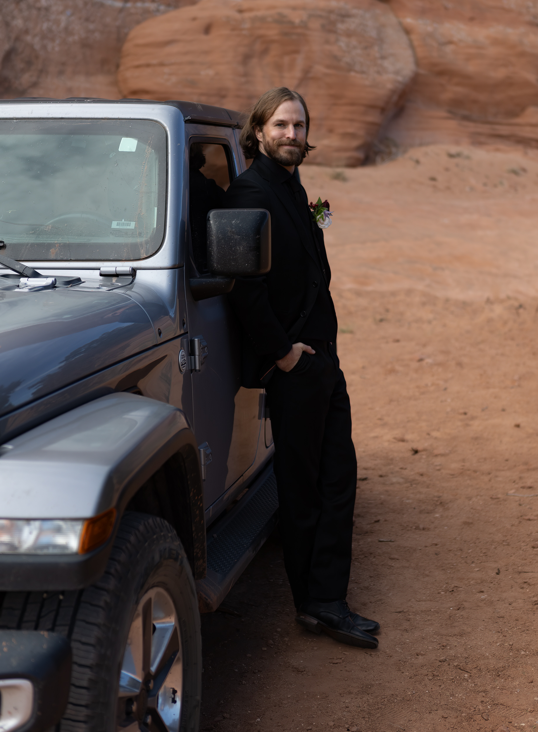 leaning against jeep
