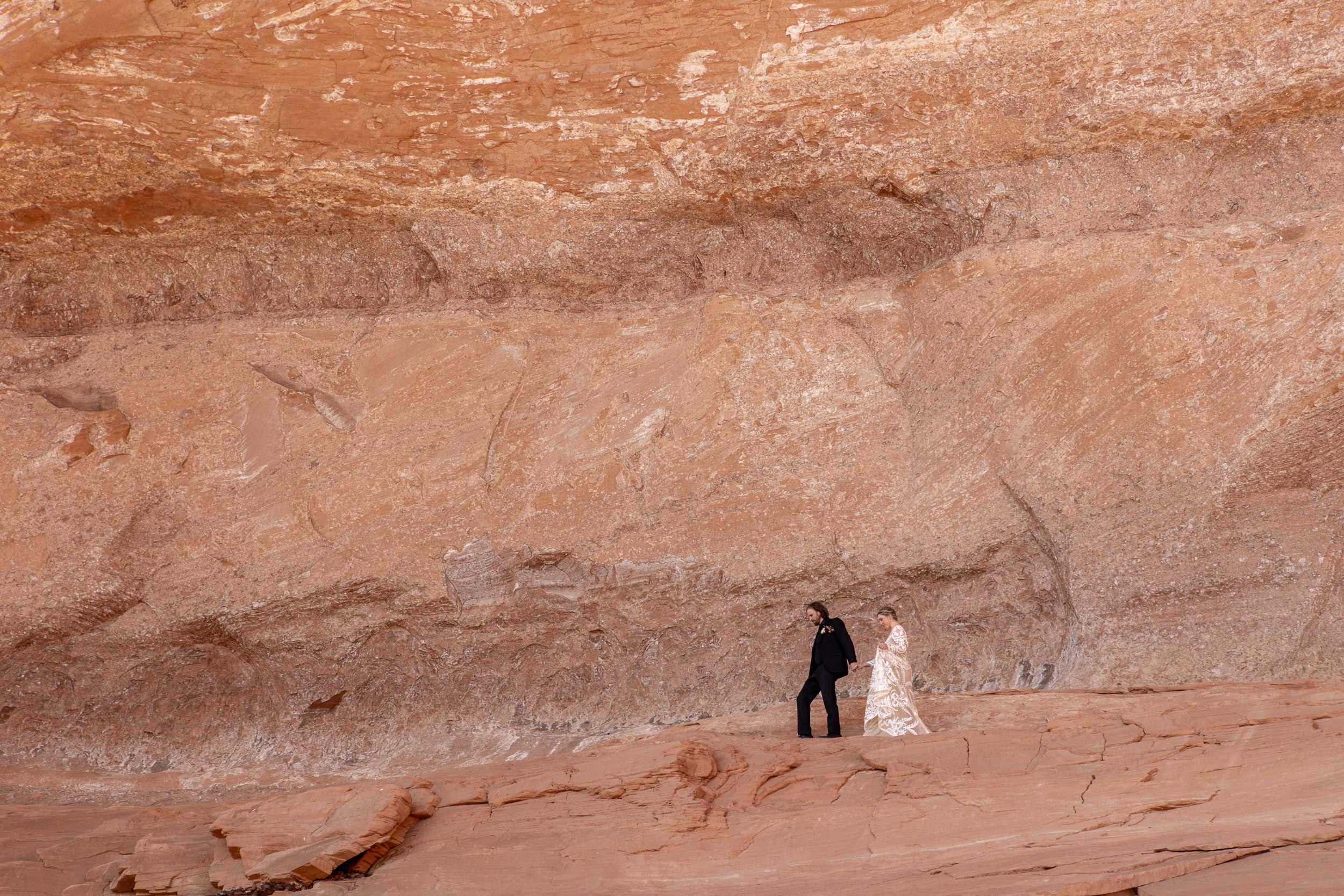 walking along the ledge to the arch