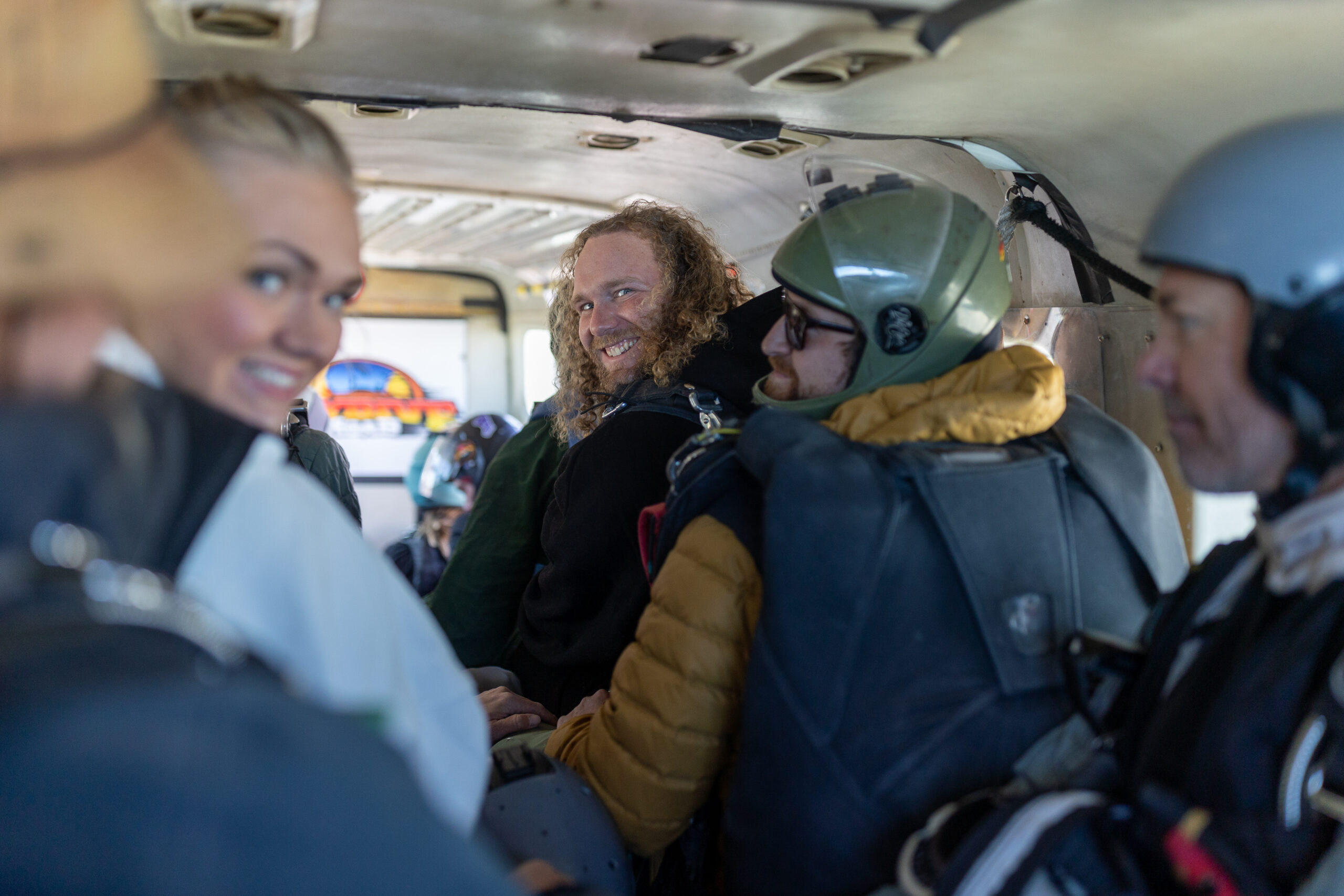 A couple skydiving together during their Moab elopement day, choosing a bucket list experience to begin their marriage