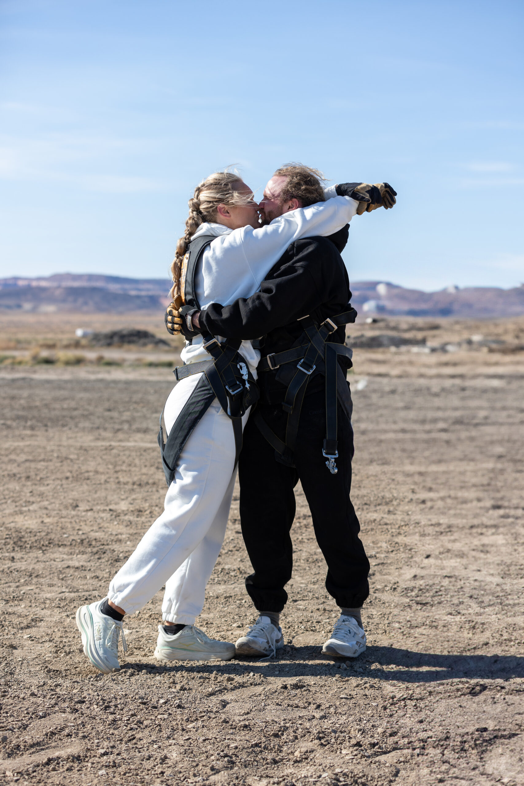 The moment after completing a bucket list skydive on their Moab elopement day