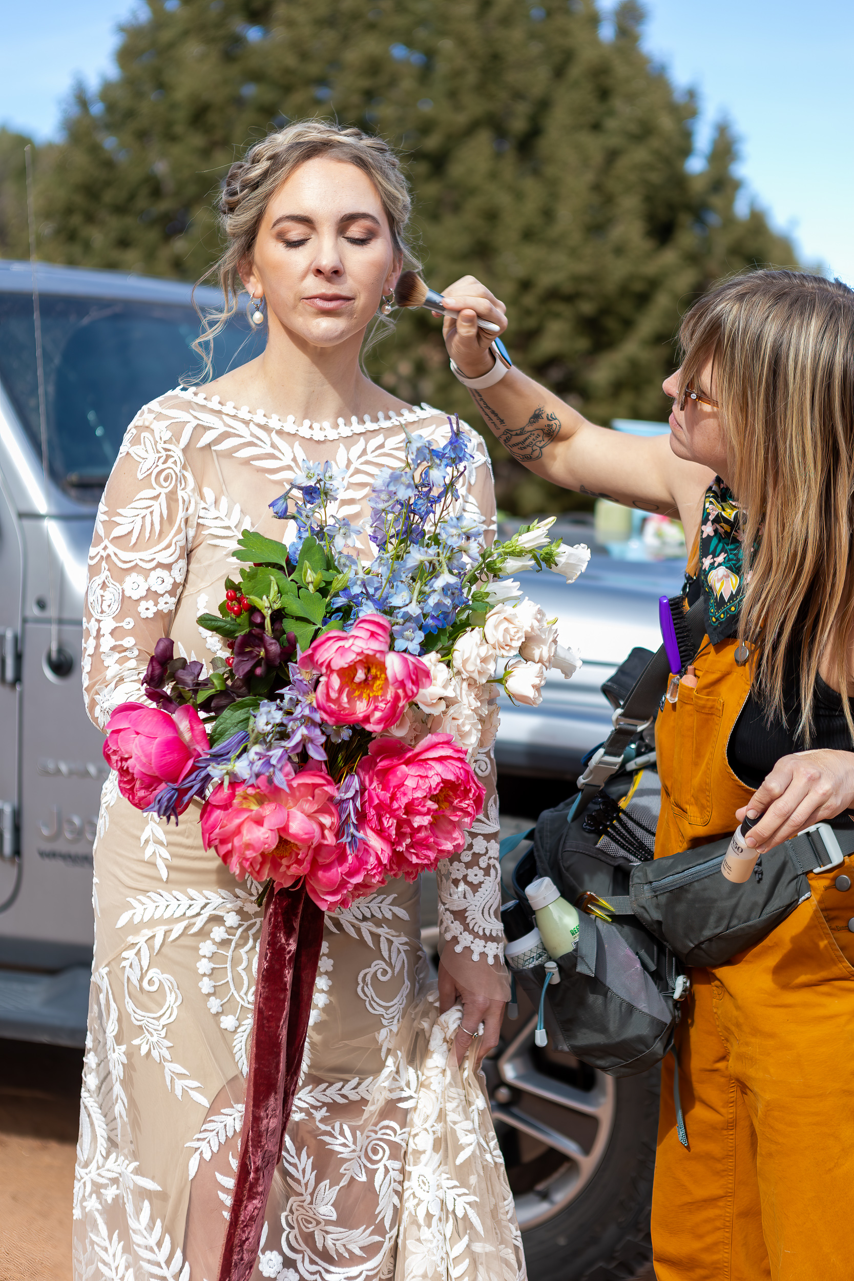 makeup artist applying makeup outsie