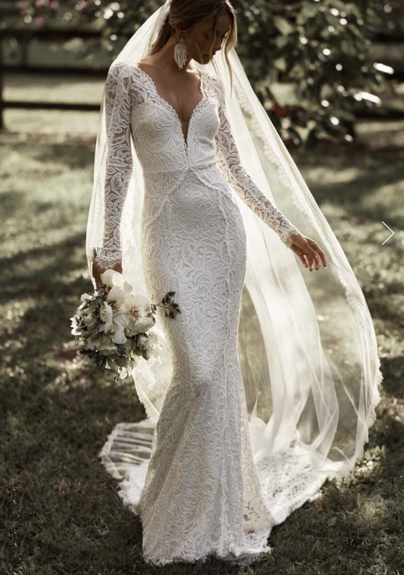 unique wedding dress perfect for a moab elopement. lace fabric. Long veil flowing in the wind. 