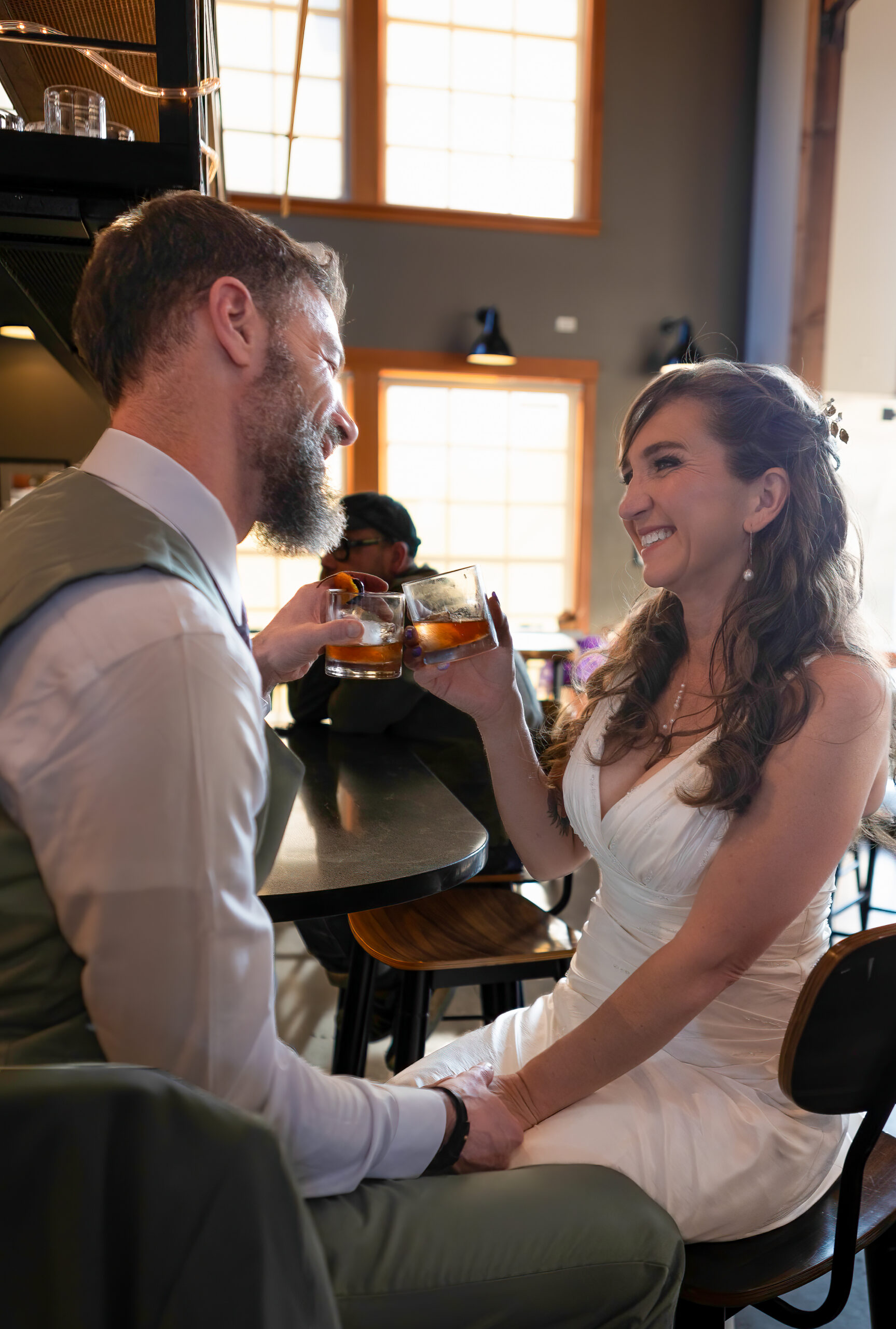 Bride and groom sharing a toast at Pelican Brewing Company