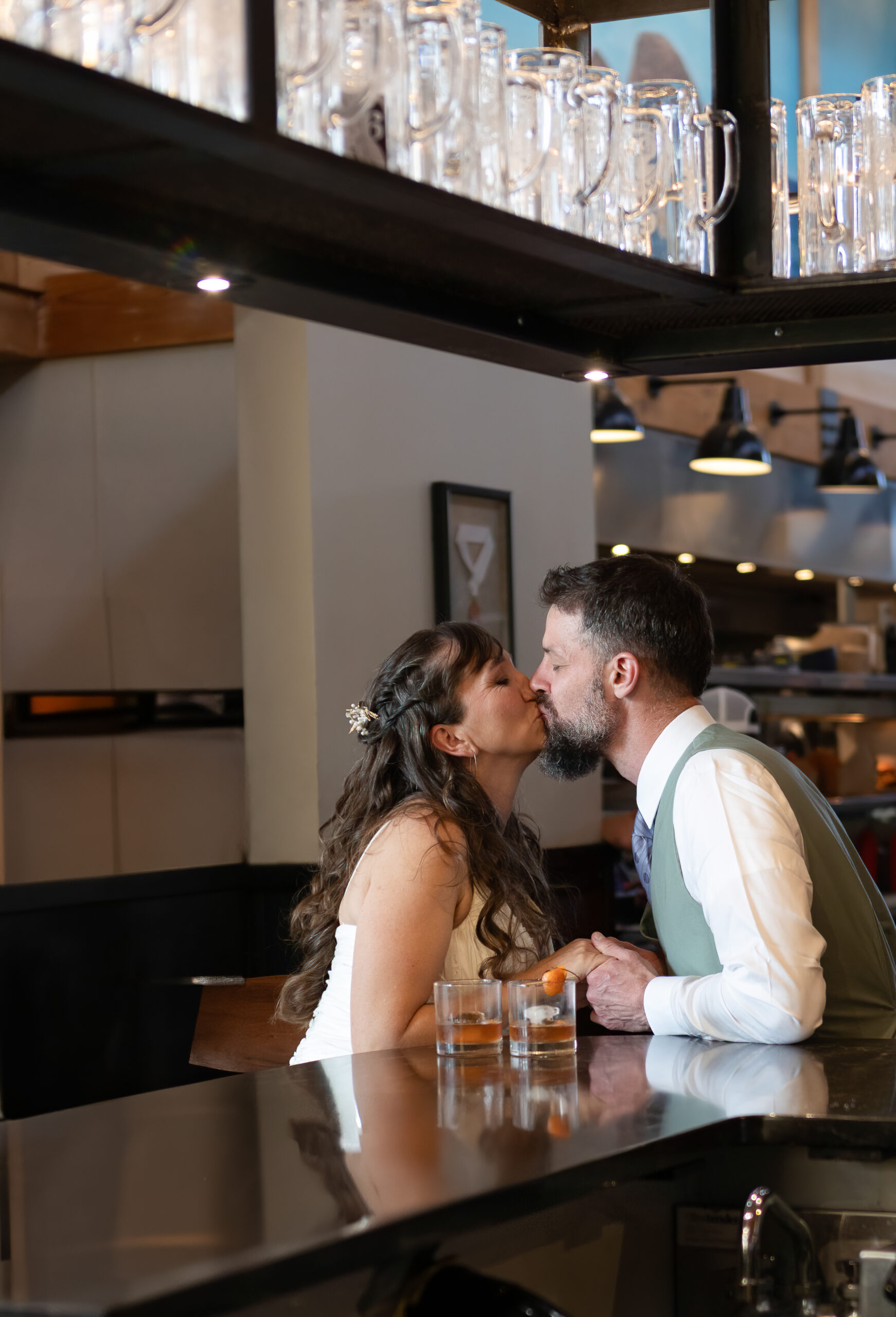 couple sitting at a bar at a local restaurant in cannon beach 