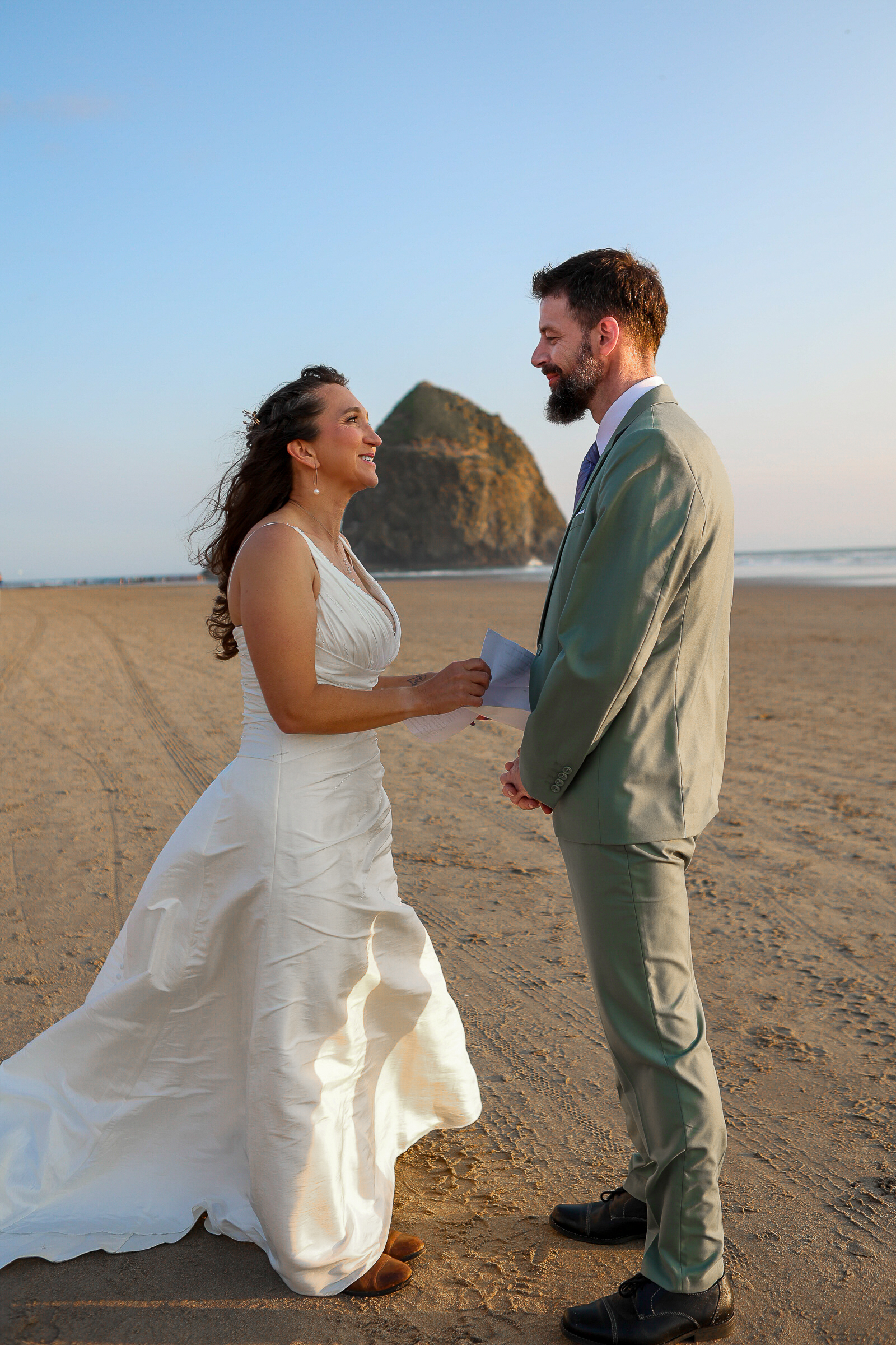 Intimate vows in front of haystack rock along the Oregon Coast