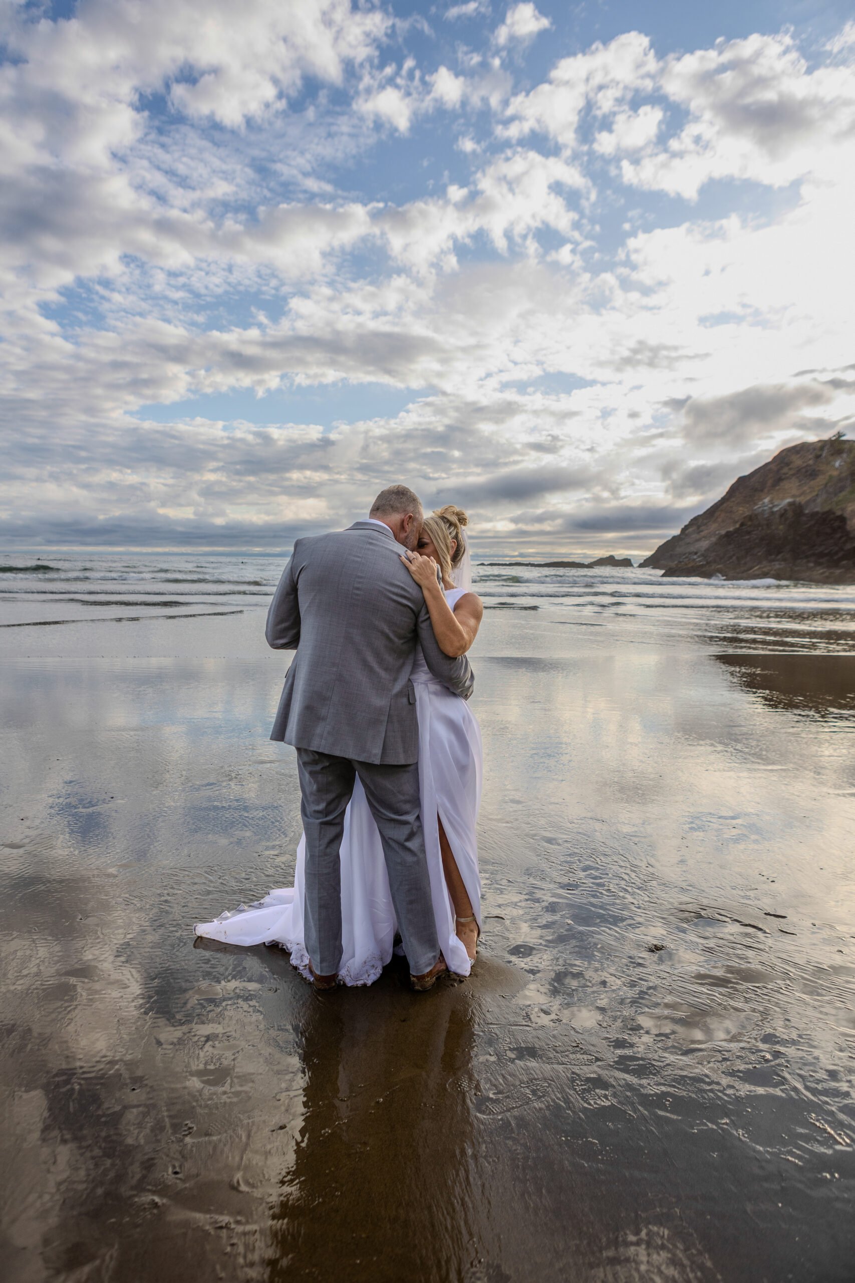 Sunset first dance as part of their Oregon Coast elopement activities