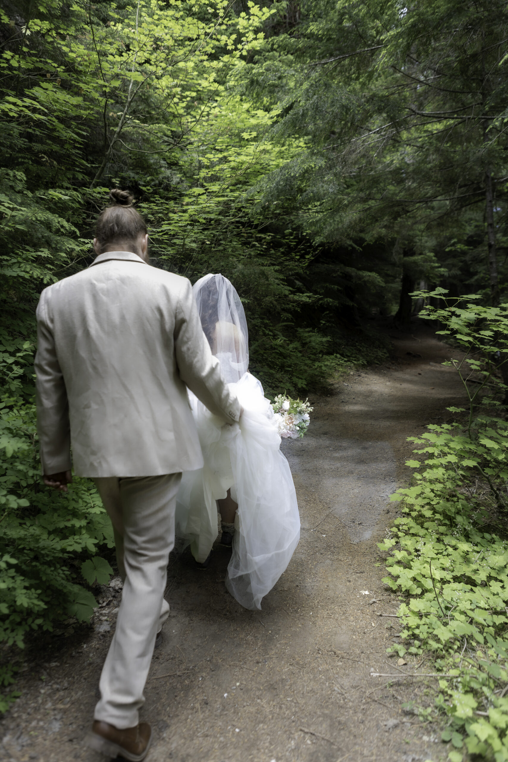 Couple hiking for a PNW summer elopement